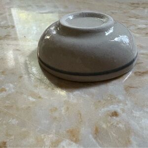 25 lovely Cream Ceramic Bowls with a navy stripe. $3 each